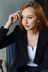 Beautiful businesswoman in black business suit.