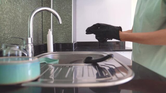 Young Woman Removes Protective Gloves From Hands After Washing Dishes, Concept Of Hand Health Care.