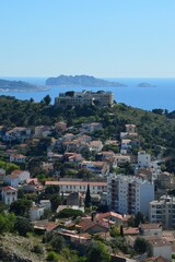Fototapeta premium a village in front of the sea on a steep cliff