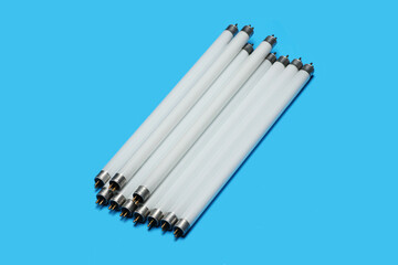 A stack of fluorescent light bulbs.