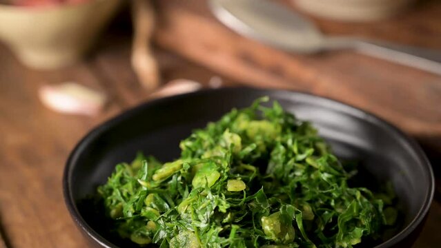 Caldo verde popular soup in Portuguese cuisine. traditional ingredients for caldo verde are potatoes, collard greens , olive oil and salt. Additionally garlic or onion may be added.