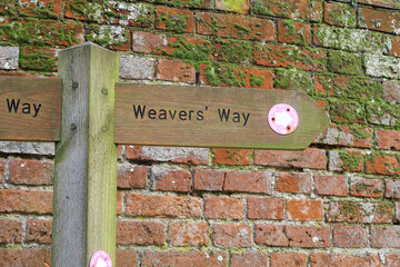 Signpost showing the Weavers Way public footpath