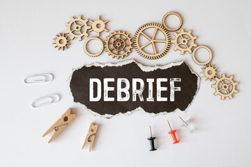 debrief word in a dictionary. debrief concept