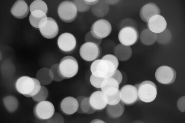 Black and white light bokeh for holiday lights background.
