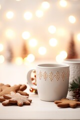 Obraz na płótnie Canvas Elegant Christmas mug with snowflake design and cookies. Simple and cozy Christmas cup with gingerbread treats.