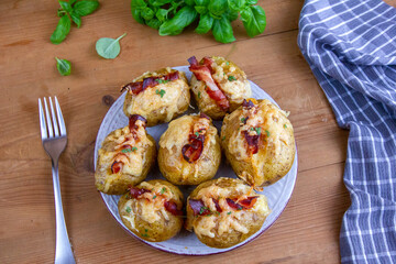 Baked potatoes with bacon and mozzarella