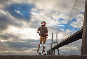 Roller skating teen in outdoors rollerblading on inline skates. Caucasian young girl in outdoor activities.