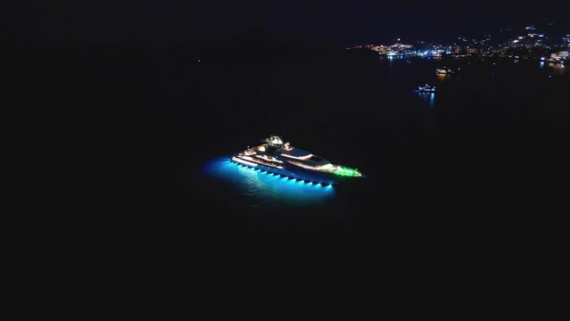 Orbiting aerial shot of big yatch in Cabo San Lucas Mexico