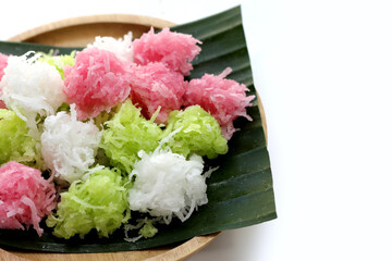 Sweet coconut balls, crispy coconut candies (Maprao Gaew). Thai traditional dessert
