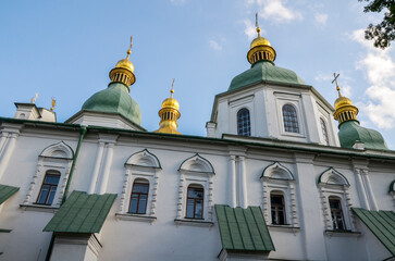 Fototapeta na wymiar Architectural landmark of the famous medieval St Sophia Cathedral with green and golden domes, in the center of Kyiv, Ukraine 