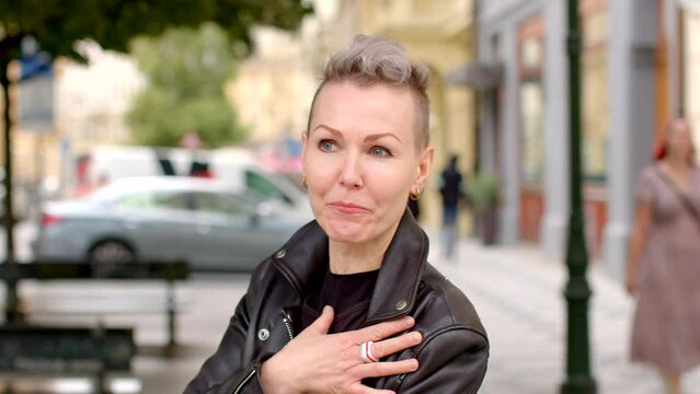 Lifestyle portrait of a woman expressing her own opinion while looking into TV camera. Diverse voices and perspectives in media, showcasing an individuals autonomy in sharing their opinions.