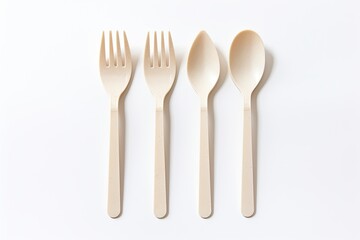 Biodegradable cutlery isolated on white.