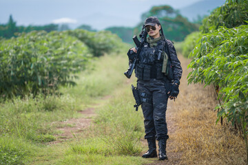 Female Thai soldier surveying during field training