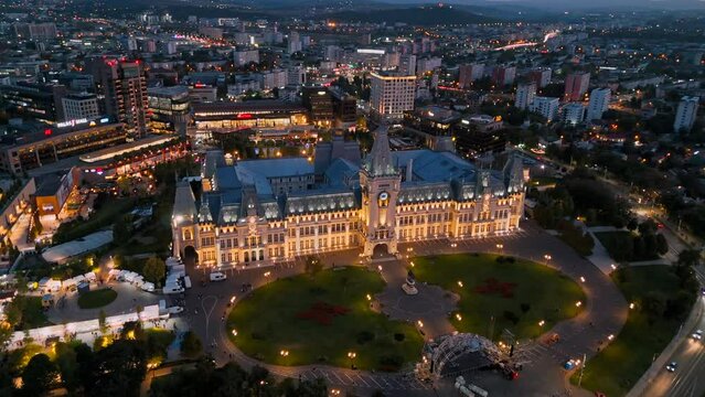 Aerial drone view of Iasi at evening, Romania. Palace of Culture with other buildings, mall and greenery around
