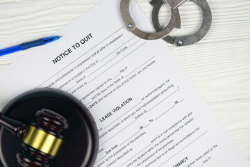 Notice to quit or eviction notice blank document paper ready to fill with handcuffs and judge...