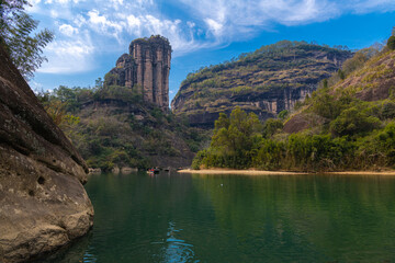 Fototapeta na wymiar Horizontal image of the Wuyishan Yufu Peak, Fujian, China behind the rock