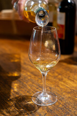 Tasting of sweet dessert Sauternes wines in old wine domain on Sauternes vineyards in Barsac village affected by Botrytis cinerea noble rot,  Bordeaux, France