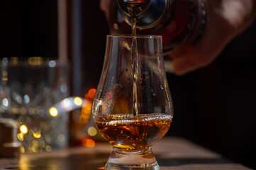 Glasses of single malt and blended scotch whisky served in bar in Edinburgh, Scotland, UK with...