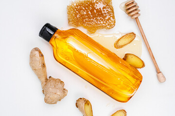 Shower gel with the aroma of honey and ginger. Shampoo on a white background. Mockup.