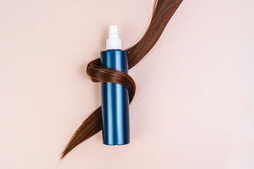 Spray for hair styling. Hair care product and beautiful Shiny healthy hair. Cosmetics. Mask for dry hair, shampoo, conditioner. Eco care product. bottle mockup. brunette