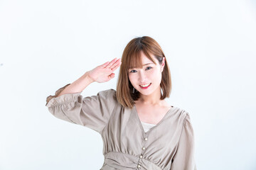 敬礼のポーズをする女性　smiling woman