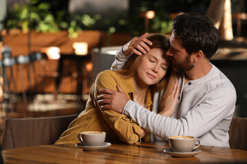 Romantic date. Lovely couple spending time together in cafe