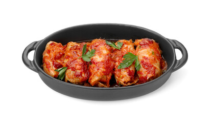 Baking dish of delicious stuffed cabbage rolls cooked with homemade tomato sauce isolated on white
