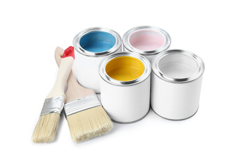 Cans of colorful paints and brushes isolated on white