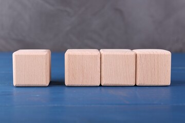International Organization for Standardization. Cubes with check mark and abbreviation ISO on blue...