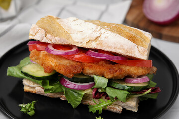 Delicious sandwich with schnitzel on white table, closeup
