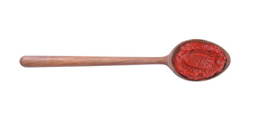 Wooden spoon of tasty tomato paste isolated on white, top view