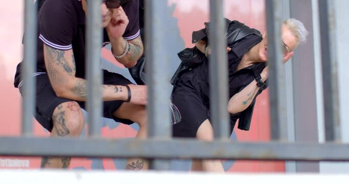 Adult couple poses, with woman expressing surprise at camera, Wow scream. Punk style embodying sense of anarchy. Unconventional fashion choices, rebellious attitudes, and rejection of mainstream norms