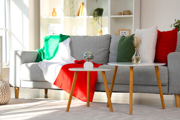 Interior of living room with Italian flag on sofa