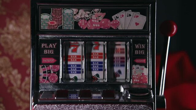 Classic retro casino slot machine spinning winning jackpot closeup loop. One-armed bandit.