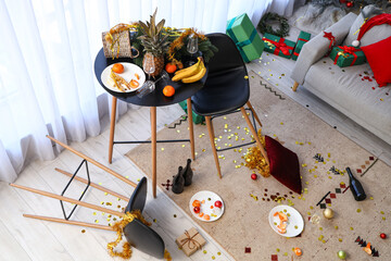 Interior of messy living room after New Year party