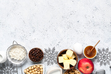 Beautiful composition with different ingredients for preparing Christmas pie on white background