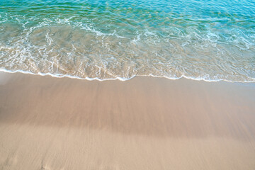 Tropical sea beach with sand and wave of the sea