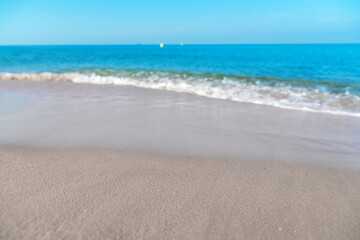 Tropical sea beach with sand and wave of the sea