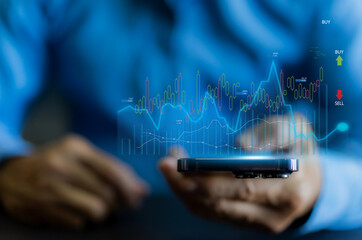 Successful of trader use phone trading stock exchange graph money, global economic, trader investor,graph money of block chain stock market cryptocurrency selling and buy with price chart data graph
