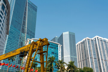 Naklejka premium Hanoi city with construction crane and high-rise buildings on background