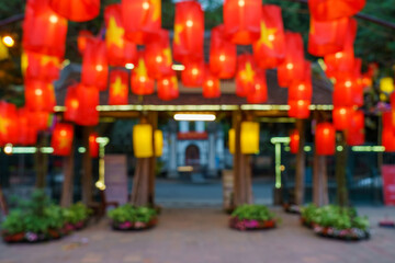 Defocused red lanterns hanging on street. Oriental festive style background