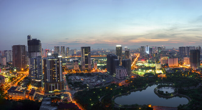 Fototapeta Cityscape of Hanoi skyline at Cau Giay park during sunset time in Hanoi city, Vietnam