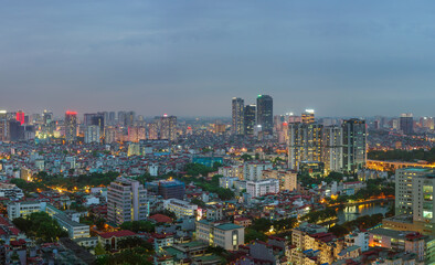 Fototapeta premium Cityscape of Hanoi skyline at Nguyen Chi Thanh street, Dong Da district during sunset time in Hanoi city, Vietnam in 2020