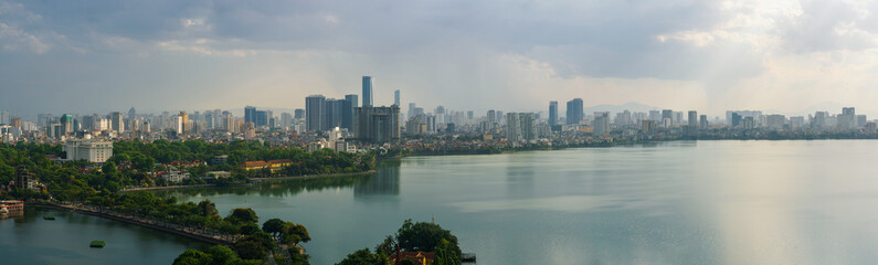 Naklejka premium Hanoi cityscape with skyline view during sunset period at West Lake ( Ho Tay ) in 2020