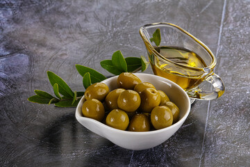 Ripe tasty green olives with branch