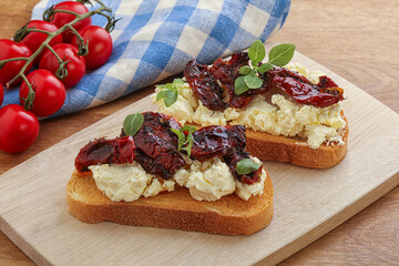 Bruschetta with soft cheese and tomato