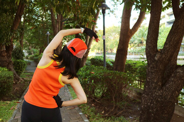 Active Woman Stretching in the Garden