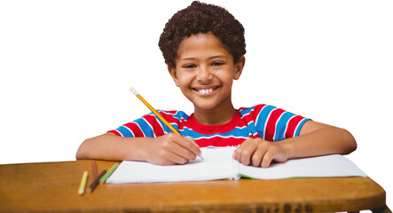 Digital png photo of happy biracial boy writing in notebook and smiling on transparent background
