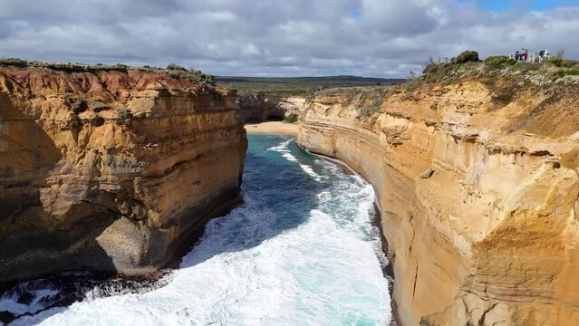 Aerial views of the 12 Apostles, limestone stacks along the Great Ocean Road in Victoria, Australia. Dramatic cliffs, turquoise waters, and crashing waves. Australia's most popular tourist destination