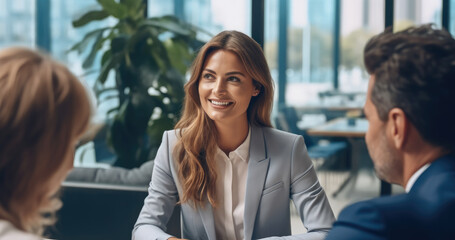A financial advisor talking with clients in office, Discussing finances and investing strategies.
